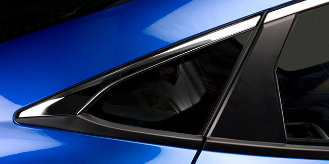 Blue sedan with a chrome 3M exterior trim film.
