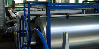 Image of large rolls of sheet metal

