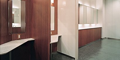 dinoc finishes on cabinets and walls in a commercial bathroom 
