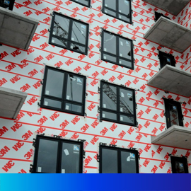 Image of a building with 3M™ air barrier showing before the final exterior is applied