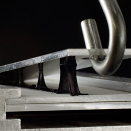 3M VHB tape reworkability lab test showing the clean removal and disassembly with 3M electronics bonding solutions.