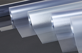 Five rolls of overlaminate exemplify the array of finishes for graphic wraps.
