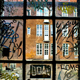 Glass windowpanes with graffiti.