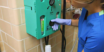 3M chemical dispenser being used
