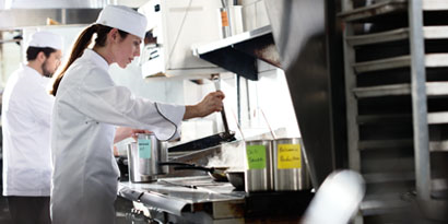 head chef cooking with sous chefs

