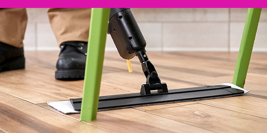 3M Easy Trap dusting tool with a cleaning professional’s feet in the background.
