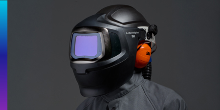 Worker using 3M speedglas 9100mp welding helmet and 3M adflo powered air purifier respirator
