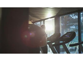 Video still of display panels on exercise machines