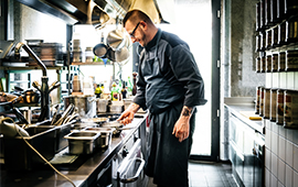 chef working behind the counter to prepare food at a hip restaurant