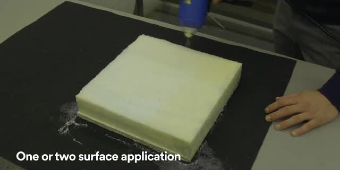 Still of a worker applying 3M™ Sprayable Hot Melt Adhesive 6111 to a foam cushion with text “One or two surface application”