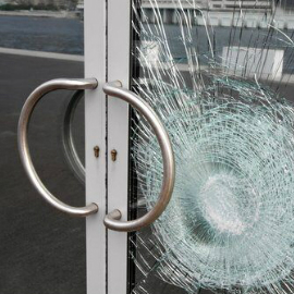 Glass door with shattered glass.
