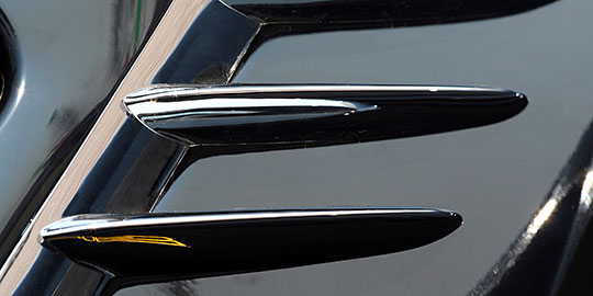 Decorative trim mounted on painted surface
