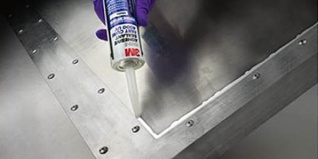Adhesive sealant being squeezed
