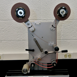 Image of the machine set up to apply two strips of tape simultaneously