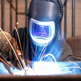 Welder With Speedglas Helmet