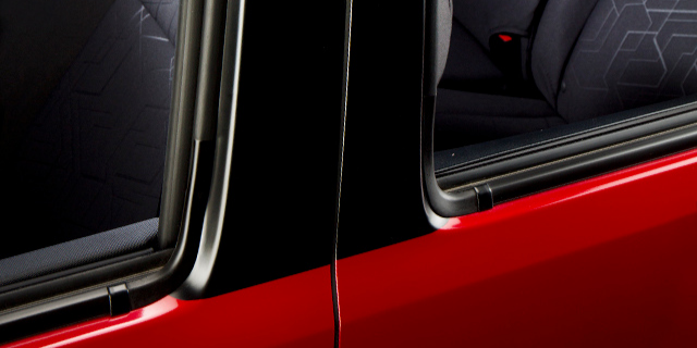 Two car windows with 3M blackout film on it.
