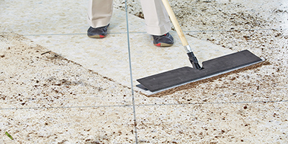 man dusting floor
